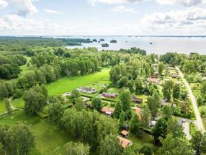 an aerial view of a park with a lake at Holiday house in Grythem, Orebro, within walking distance to lake in Örebro