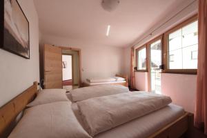 Postel nebo postele na pokoji v ubytování Appartement Strolz