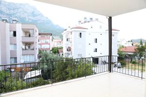 a balcony with a view of some buildings at Kemer Sunrise Suit in Kemer