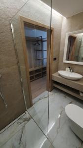 a bathroom with a glass shower and a sink at Villa Olimpijska 2 - Centrum in Wisła