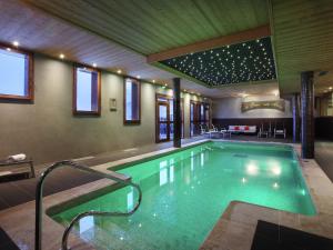 a swimming pool in a building with at Modern apartment located in the extensive Paradiski ski area in Arc 2000