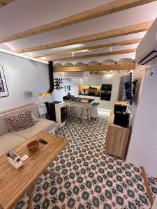 a living room with a couch and a table at Casa Kai Altea - Torre de Bellaguarda in Altea