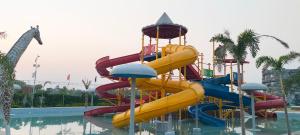 a water slide in a pool at a resort at Fun N City Water Park , Adventure & Resort , Patna in Nadwān