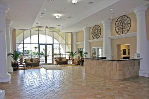 a lobby of a hotel with couches and a bar at Ariel Dunes II 2203 in Destin