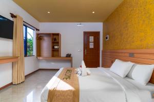 TV a/nebo společenská místnost v ubytování Nala Veli Beach & Spa