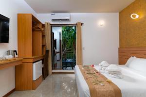 Postel nebo postele na pokoji v ubytování Nala Veli Beach & Spa