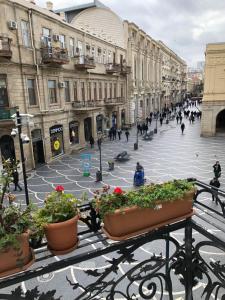 a city street with people walking on the street at Nizami Street VIP Apartment in Baku