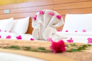 Postel nebo postele na pokoji v ubytování Nala Veli Beach & Spa