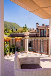 a view of a house from a patio with a fence at RESIDENCE VILLA TOTA in Spoleto