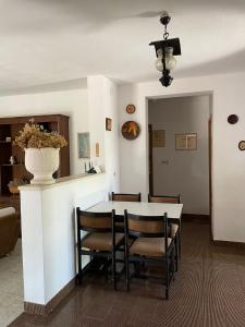 a dining room with a table and chairs at House for rent in Žrnovo