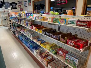 a grocery store aisle with food and drinks at Badlands Hotel & Campground in Interior