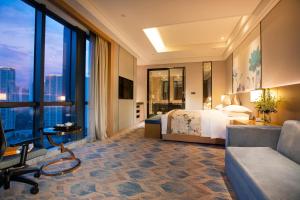 a hotel room with a bed and a large window at Courtyard by Marriott Hangzhou Xiaoshan in Hangzhou
