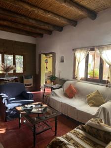 a living room with a couch and a table at La Hoyada in Tilcara