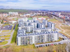 an aerial view of a large apartment building at Hello Apartments RIO with private parking in Gdańsk