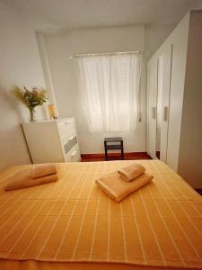 Un pat sau paturi într-o cameră la Villa EMMA