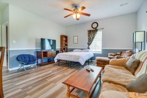 a living room with a couch and a table at Kentucky Retreat Near Williamstown Lake! in Williamstown