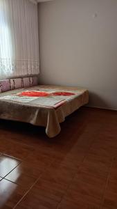 a bed sitting in a corner of a room at Ayten's Sweet House in Trabzon
