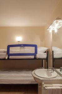 Postel nebo postele na pokoji v ubytování Hotel Du Soleil