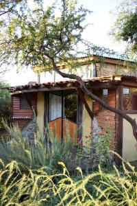 a house with a large window on the side of it at Hexágono de San Javier in San Javier