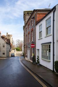 a street in a town with a castle in the background at The Bakery in Arundel
