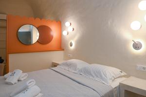 Postel nebo postele na pokoji v ubytování Naos Suites