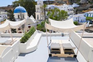 a view from the rooftop of a resort with white buildings at Naos Suites in Vóthon
