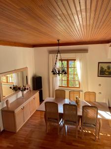 a kitchen with a table and chairs and a sink at Gyra Villas - Villa Ermis with private pool in Lefkada
