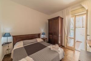 Letto o letti in una camera di Borgo Marino Plemmirio