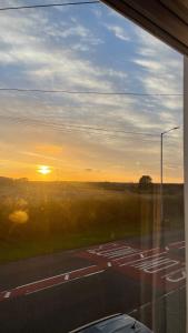 a view of the sunset from a bus window at Idyllic Countryside Retreat in Durham County near Sedgefield in Trimdon Grange