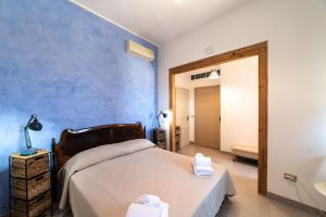 Letto o letti in una camera di Borgo Marino Plemmirio