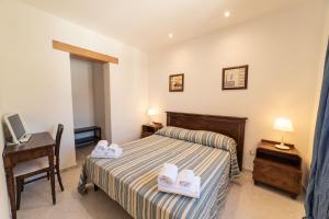 Letto o letti in una camera di Borgo Marino Plemmirio
