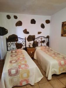 A bed or beds in a room at Casa Rural Sanjora