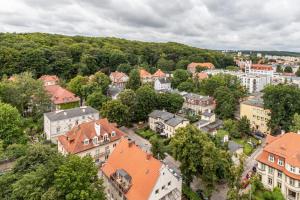 an aerial view of a town with buildings and trees at City Panorama Gdańsk Spacious Apartments by Renters in Gdańsk