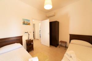 Letto o letti in una camera di Borgo Marino Plemmirio