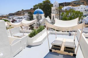 a view from the roof of a house with a slide at Naos Suites in Vóthon