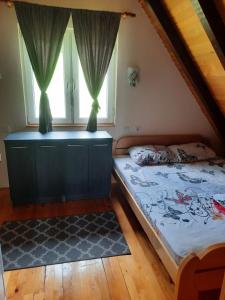 Postel nebo postele na pokoji v ubytování Kućica na Tari