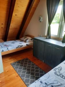 Postel nebo postele na pokoji v ubytování Kućica na Tari
