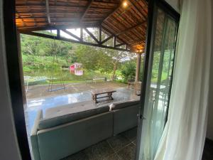 a view of a patio with a bench and a pool at Casa Sabia in Pacoti