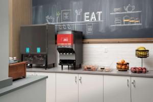 a kitchen with a coffee maker on a counter at Hampton Inn Baltimore-Downtown-Convention Center in Baltimore