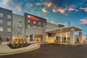 a hotel with a sign on the front of it at Hilton Garden Inn Jackson in Jackson