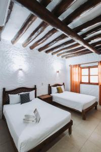 Postel nebo postele na pokoji v ubytování Hotel Casa Barbara Holbox