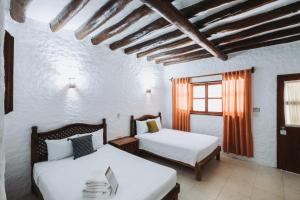 Postel nebo postele na pokoji v ubytování Hotel Casa Barbara Holbox + 37 fotografií