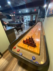a dog is standing next to a bowling alley at Game Junction in Montgomery