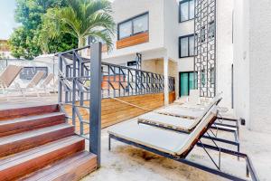 a pair of beds on a balcony of a building at Seven Boutique Unit #36 in Cancún