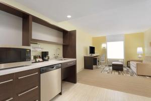 a large kitchen with a sink and a microwave at Home2 Suites by Hilton Pittsburgh - McCandless, PA in McCandless Township