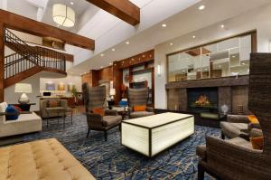 a lobby of a hotel with a fireplace at Hilton Knoxville in Knoxville