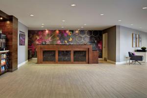 a lobby with a large screen in the middle at DoubleTree by Hilton Fairfield Hotel & Suites in Fairfield