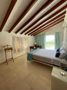 A bed or beds in a room at Casa Puput