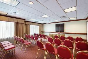 a conference room with red chairs and a table at Homewood Suites by Hilton Newark-Wilmington South Area in Newark +24 photos