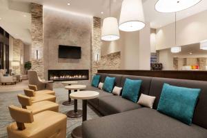 a lobby with a couch and a fireplace at Homewood Suites by Hilton Washington DC Convention Center in Washington, D.C.